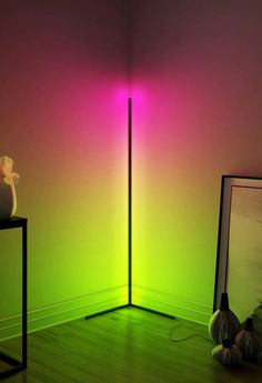 a room with a green and pink light in the corner