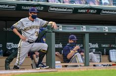 a baseball player standing on top of a field