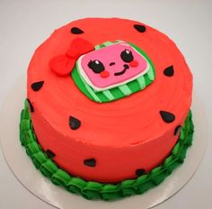 a watermelon themed cake on a white plate