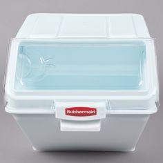 a close up of a cooler on a gray surface with a red label that says rubber maid