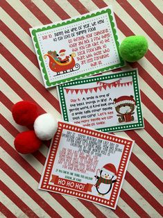 three christmas cards with pom poms on the table