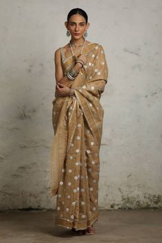 Beige tussar silk saree with metallic silver bootis and golden zari applique hand embroidery. Comes with an unstitched blouse piece. - Aza Fashions Transitional Gold Pre-draped Saree With Gota Work, Transitional Saree With Gota Work, Fitted Art Silk Saree With Gota Work, Fitted Silk Saree With Gota Work, Semi-stitched Tussar Silk Saree With Gota Work, Transitional Season Saree With Gota Work, Cotton Silk Pre-draped Saree With Gota Work, Transitional Raw Silk Pre-draped Saree With Gota Work, Fitted Tissue Silk Saree With Gota Work