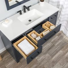 a bathroom vanity with two drawers under the sink