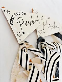 two black and white flags with the words happy birthday written on them are tied together