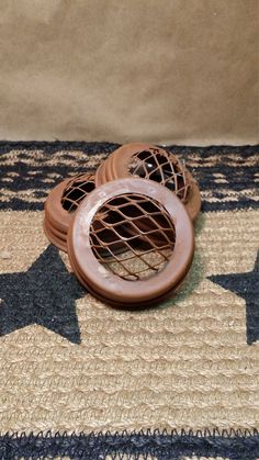 three air ventilators sitting on top of a rug