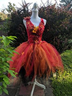 a dress made out of tulle with flowers on it