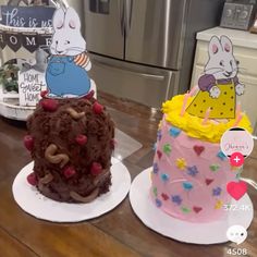 two cakes decorated to look like animals sitting on top of each other