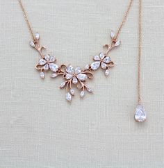 Dainty Rose gold CZ Bridal Back drop necklace that you can choose with or without the backdrop. Perfect for a backless dress.- Handcrafted with Swarovski Pure Brilliance components.- All clear stones - Rhodium or rose gold finish- Necklace measures 16 inches and extends to 18 inches- Backdrop in photos measures 6 inches but you can choose your desired length from drop down menu- Nickel free and hypoallergenicThis is an original design by © Treasures by AgnesPLEASE ALLOW APPROX 10 BUSINESS DAYS F Bridal Backdrop Necklace, Backdrop Necklace, Crystal Wedding Jewelry, Dainty Rose, Backdrops Necklace, Back Necklace, Necklace Bridal, Jewelry Dainty, Back Drop