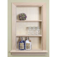 a shelf with bottles and glasses on it