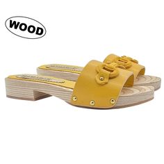 Comfortable and with a bright colour, this year the classic Gioie Italiane low-heeled clog is reconfirmed, perfect to wear for summer evenings with friends, or walks by the sea. Definitely comfortable for our feet, without sacrificing femininity. Women's clogs with brown wooden base Yellow leather upper with matching accessory Non-slip sole Heel height 2.5 cm and 1.5 cm plateau Made entirely by specialized Italian personnel Handcrafted products using the best materials. BEFORE PURCHASING DO NOT Yellow Open Toe Clogs With Rubber Sole, Yellow Mules With Rubber Sole, Summer Flat Clogs With Leather Sole, Clogs For Women, Clogs And Mules, Wooden Clogs, Women's Clogs, Leather Clogs, Matching Accessories