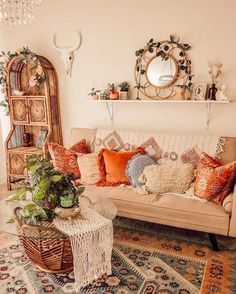 a living room filled with lots of furniture and colorful pillows on top of it's couches