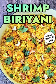 shrimp biriyani in a white bowl with green garnish on top