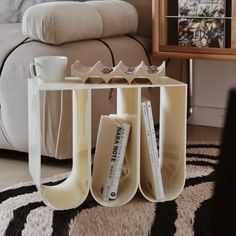 a coffee table with books and magazines on it