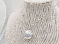 "A beautiful and lovely seashell locket necklace inside a velvet seashell gift box. It features a shining silver seashell and suspends in a silver finished brass chain along with lobster claw clasp closure. The shell locket inside can hold pictures in both side 16mm x 14mm. The necklace is available in seashell locket necklace only, or adding a stimulated cream white pearl charm along withe the seashell locekt necklace. The pearl is genuine Swarovski 6mm pearl. It is a wonderful idea for gift gi Shell Pendant Charm Necklaces For Gifts, Shell Charm Necklace As A Gift, Shell Shape Charm Necklace As A Gift, Shell Charm Necklaces As Gift, Ocean-inspired Shell Charm Necklace Gift, Silver Shell Gift, Silver Shell Necklace Perfect For Gifts, Silver Shell Necklace For Gifts, Silver Shell Necklace As A Gift