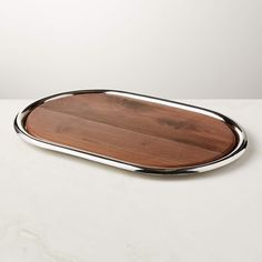 a wooden and metal tray on a white table