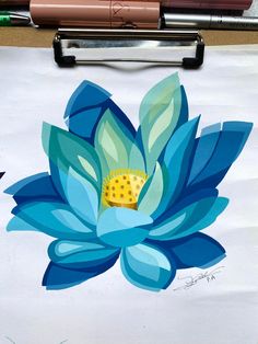 a drawing of a blue flower on a piece of paper