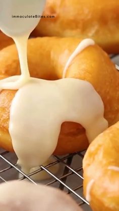 glazed donuts being drizzled with icing