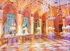 an elaborately decorated ballroom with chandeliers and tables