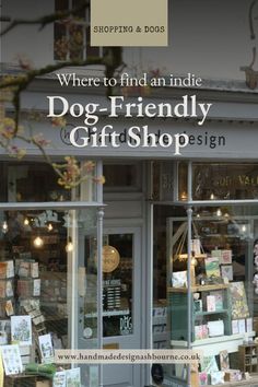 there is a dog - friendly gift shop on the front of this storefront window