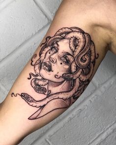 a woman with an octopus tattoo on her arm