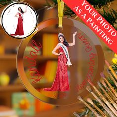 a christmas ornament with an image of a woman in a red dress