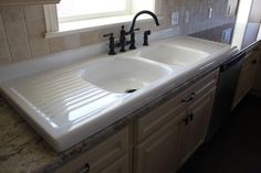 the kitchen sink is clean and ready for us to use in its new home,