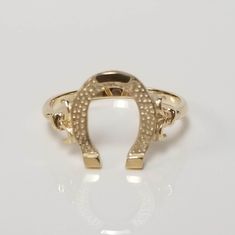 "Thanks for shopping our vintage estate store. We tend to sell well below wholesale and truly hope you enjoy all of our items. Many of the items are one of a kind, so please enjoy scrolling through the pictures and hopefully something will catch your eye. Brown spots are from reflections. Estate 14k yellow gold horseshoe ring. Reminds me of an authentic horseshoe or lucky horseshoe. Came from a jewelry store that was closing. Ring size: 7 Setting: 1/2\" Band width: 2.5mm Weight: 2.0 gram Beautif Vintage Gold Horseshoe Jewelry, Elegant Horseshoe Rings For Gifts, Gold Hallmarked Horseshoe Jewelry, Yellow Gold Horseshoe Jewelry For Anniversary, Classic Horseshoe Shaped Anniversary Rings, Gold Engraved Horseshoe Jewelry, Classic Yellow Gold Horseshoe Jewelry, Gold Horseshoe Jewelry For Anniversary, Elegant Yellow Gold Horseshoe Rings