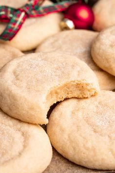 some sugar cookies that have been cut in half and are sitting on a table next to a christmas ornament