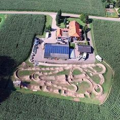 an aerial view of a farm with a solar panel on the roof