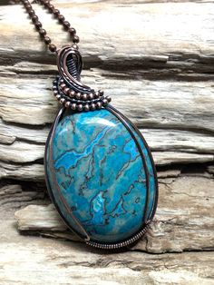 This Crazy Lace Agate pendant is a beautiful deep turquoise color and always a favorite stone. The cabochon has been carefully wrapped in copper wire and is suspended from a copper ball chain in the length of your choice.  The necklace has been antiqued for a richer look. Crazy Lace Agate with its twisting and turning bands is elegant and dynamic. It promotes mental agility, liveliness and variety, and encourages flexibility in thinking and action. Turquoise Agate Wire Wrapped Necklaces, Turquoise Agate Wire Wrapped Necklace, Deep Turquoise, Agate Pendant Necklace, Crazy Lace Agate, Agate Pendant, Lace Agate, Turquoise Color, Ball Chain