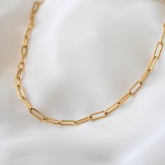 "Chunky and trendy, this necklace features thick chain links that measure 5 mm wide. 18K gold-plated stainless steel features a deeper, more saturated yellow color compared to 14K gold filled items. tarnish-resistant, water-resistant, and hypoallergenic. Lengths 13 inches and under will come with an additional 2 inch extension so that you can adjust it to fit perfectly and comfortably. --------------------♥ PROMOS ♥-------------------- Want 10% off? Join the mailing list by visiting http://bit.l Gold Paperclip Chain Bracelet As Gift, Paperclip Bracelet With Cable Chain As A Gift, Paperclip Chain Necklace As A Gift, Minimalist Jewelry With Chunky Paperclip Chain, Gold Delicate Chain Paperclip Bracelet, Gold Paperclip Chain Bracelet For Gift, Minimalist Chunky Paperclip Chain Jewelry, Gift Paperclip Bracelet With Cable Chain, Paperclip Link Bracelet As Gift