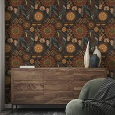 a living room with a chair, vase and wallpaper on the wall in front of it