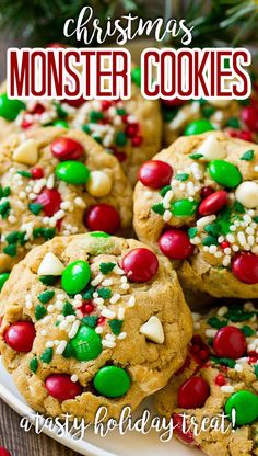 christmas monster cookies on a plate with candy and sprinkles