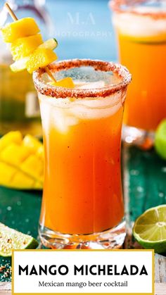 two glasses filled with orange juice and garnished with limes on a table