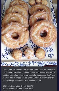 there are many doughnuts on the blue and white platter with information about them