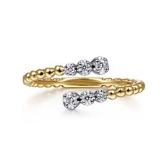 two yellow and white gold rings with diamonds on each side, one in the middle