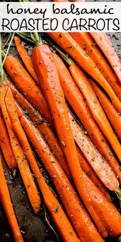 roasted carrots with honey balsami on top and garlic sprigs in the middle