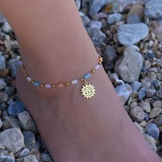 This beaded gold sun anklet is for women. Its boho style makes it a great piece of beaded summer jewelry. The ankle bracelet has an extension so the size can be adjusted. Bohemian Gold Beaded Bracelets For Vacation, Gold Bohemian Beaded Bracelets For Vacation, Gold Beaded Bracelets For Summer Beach, Summer Gold Beaded Bracelets For Beach, Gold Anklets With Beads For Summer, Summer Beach Gold Beaded Bracelets, Beaded Gold Anklets For Summer, Bohemian Gold Beaded Bracelets For Summer, Gold Bohemian Beaded Bracelets For Summer