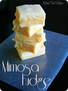 three pieces of fudge sitting on top of a blue cutting board with the words minnesota fudge written below it