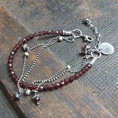 "Handmade, delicate oxidized sterling silver bracelet with garnets. The bracelet is made of silver 925 and garnets quality AAA (4 mm). It is available with either raw or polished finish. We offer bracelets in many sizes: 6\" (15 cm), 6.5\" (16,5 cm), 7\" (18cm), 7.5\" (19 cm), 8\" (20,5 cm). Choose the one that is most similar for your wrist circumference and share your actual wrist circumference in the note to your order. This way we can perfectly adjust the size of your bracelet. We send jewel Vintage Navajo Jewelry, Oxidized Silver Bracelet, Jewelry Outfit, Gorgeous Bracelet, Oxidized Silver, Mens Accessories Fashion, Beads And Wire, Oxidized Sterling Silver, Sterling Silver Bracelet