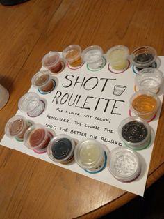 there is a sign that says shot rouleette on the table next to it