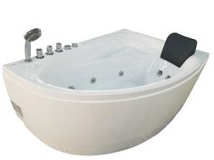 a large white bath tub sitting next to a faucet