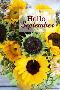 a vase filled with lots of yellow sunflowers