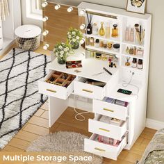 a white desk with lots of drawers and items on it in a living room area