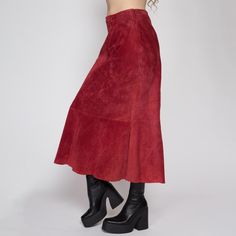 Vintage 90s boho raspberry red suede midi skirt, with a high waist, and a subtle mermaid hem. It has a side zipper for closure. Measurements and Condition: Fits like: Labeled size 12, best fits modern women's medium Fabric: Suede leather shell with a polyester lining Brand: Converge Condition: Very good, with light general wear Length: 34" Waist: 29" Hips: 40"  Shown on a 5'8" model with measurements of 34"-26"-37", usually wears a size small. See our FAQ for more info on sizing and condition ra Fitted Red Midi-length Bottoms, Fitted Red Midi Bottoms, Red Fitted Maxi Skirt For Fall, Fitted Red Maxi Skirt For Fall, Suede Midi Skirt, Midi Skirt Vintage, 90s Boho, Raspberry Red, Mermaid Skirt