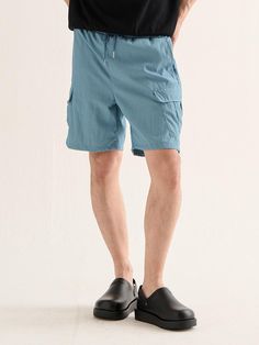 This is a casual and minimal pants by Analogmood that is made out of high quality and sturdy material. With distinctive mood of the design and comfortable wear, you can use it for your daily outfit.- Big cargo pockets for practical wear- Soft rayon and durable nylon blend fabric- Elastic waistband with string Light Blue Baggy Pants With Pockets, Functional Cotton Pants With Pockets, Functional Cotton Bottoms For Outdoor, Solid Color Straight Leg Shorts With Pockets, Solid Straight Leg Shorts With Pockets, Bottoms With Pockets For Summer Outdoor Activities, Spring Bottoms With Multiple Pockets For Outdoor Activities, Spring Outdoor Bottoms With Multiple Pockets, Summer Outdoor Pants With Functional Pockets