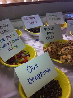 there are many different types of cookies on the table with signs in front of them