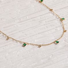 Feminine and minimalist, our vintage inspired Emerald Diamond Station Necklace is the perfect addition to any outfit. Whether you’re meeting friends for a spring picnic or traveling with your significant other, this dainty necklace can complement any personality ♡ Material: High Quality Solid 925 Sterling Silver Finish: Sterling Silver ∙ 18K Gold Featuring ~5.5mm Pear cut and ~5mm Princess cut CZ Emerald gemstones, and ~3mm Round CZ Diamonds dangling on an adjustable cable chain from 16 inches t Dainty Clavicle Chain Necklace For May Birthstone, Dainty Green Charm Necklace With Clavicle Chain, Spring Picnic, Teardrop Diamond, Meeting Friends, Link Earrings, Station Necklace, Emerald Gemstone, Cz Diamond