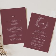 the wedding stationery is laid out next to some flowers