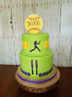 a three tiered cake decorated with softballs, bats and the name nick's on it